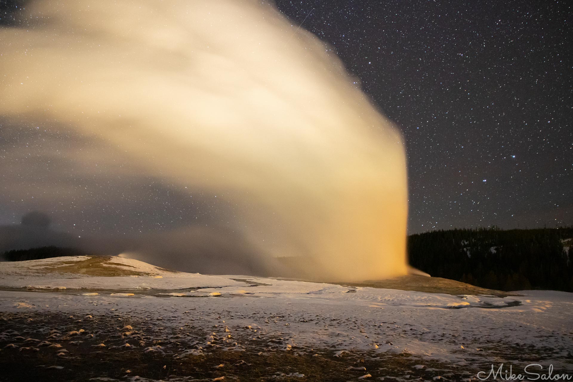 Old Faithful Eruption : A vertical jet of boiling water, then the steam blows off with the wind as Old Faithful erupts at night in Yellowstone National Park. (0D0A4091.jpg)<br>Camera: Canon EOS 5D Mark IV