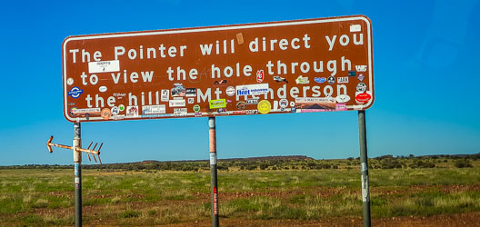 If there was a hole through Mt Henderson, we couldn't see it, but the adornments to the sign were plentiful. [3825]