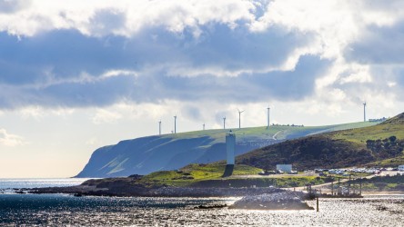 Under threatening skies, Cape Jervis shows off its unusual lighthouse and its sustainablity credentials with a windfarm on the hill. [3329]