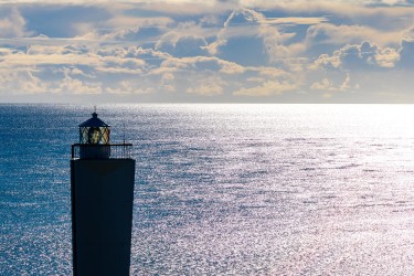 Viewing right into the setting sun, the inverted pyramid shape of the Cape Jervis lighthouse is highlighted. [3291]