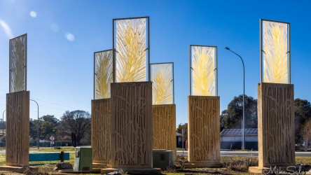 Milestone Statues by Dawn Elrington at Wallendbeen near Cootamundra, featuring glass panels with wheat designs honouring the local wheat industry. [5173]