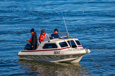 Runabout with fisherman, looking for near the Murray Mouth. The holy grail for anglers here is Mulloway or Jewfish. [1629]