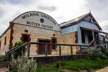 The Milang Lakeside Butter Factory has handsome limestone walls, having been built in 1892, when Milang was still a busy lakeside port and the surrounding district was rich in dairy farms. The factory became one of South Australia’s earliest co‑operative creameries, producing butter for export via the river and rail network It's now a museum and community centre. [2197].