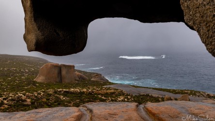 The ocean and headland as seen from under a rock overhang. [3494]