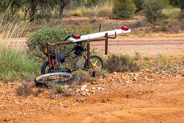 Bits of abandoned trailers and bikes create this scultpture seen in downtown Opalton. [7947]