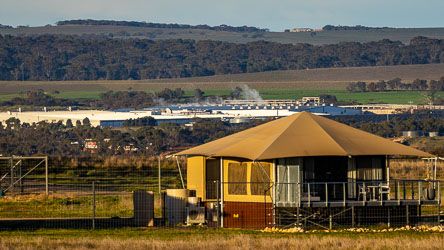The real world is not far outside the Monato Zoo. We were told that this factory converts old shipping containers to homes for FIFO miners far away, and that it operates 24/7! [2588]