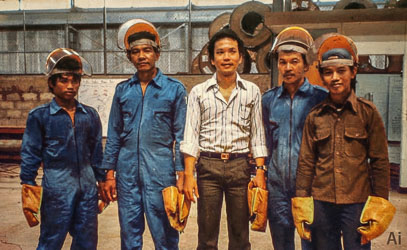 Five Indonesian Crew Members wearing heavy duty safety equipment.