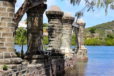 Detail view of five solid stone columns at Nelson